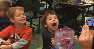 An excited winner shows off her raffle prize! 