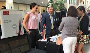 Chelsey Ryan and Aaron Santner from Cook answer questions from FDA attendee Dorothy Abel and her daughter, who was participating in Take Your Daughter to Work Day.