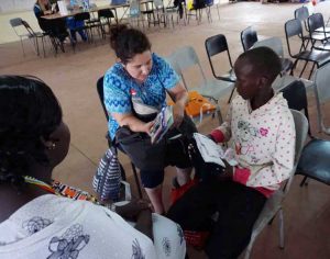 Kelly gives gifts to her sponsor child, Melenta, at the Emarti Exodus Child Development Center.
