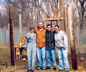Angi (in sunglasses)poses with other volunteers at the Exotic Feline Rescue Center in Indiana.