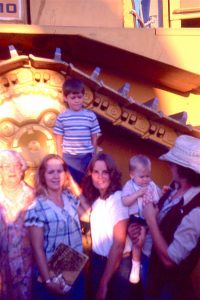 A younger Diana (in white, center) in front of the "high sprocket"of the D10 Caterpillar tractor.