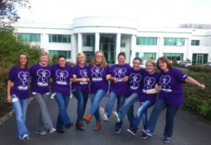 Marie, far right, poses with co-workers who ran with her in the Cook Medical Women's Mini Marathon.
