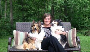 Natalie poses with her two pups, Shiloh and Bailey, who are clearly part of the family.
